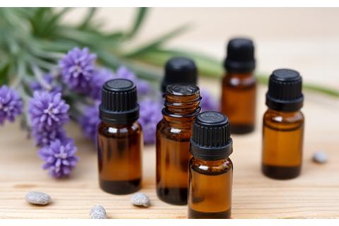 Essential oil bottles with lavender sprigs